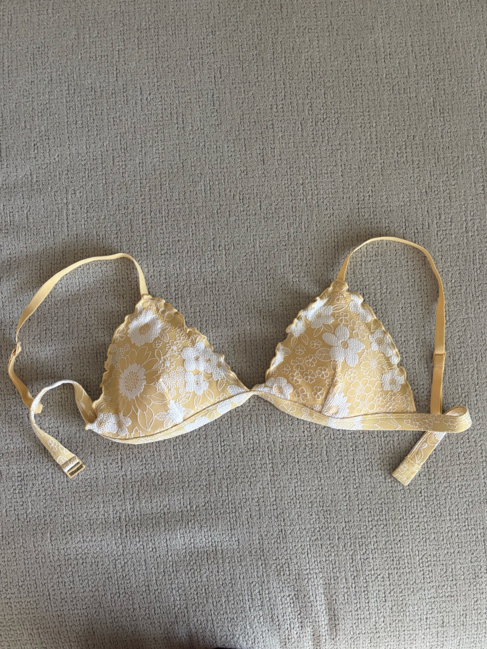 Yellow bikini top with white floral print